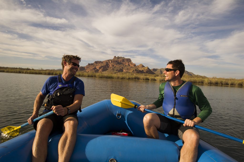 two men white water rafting