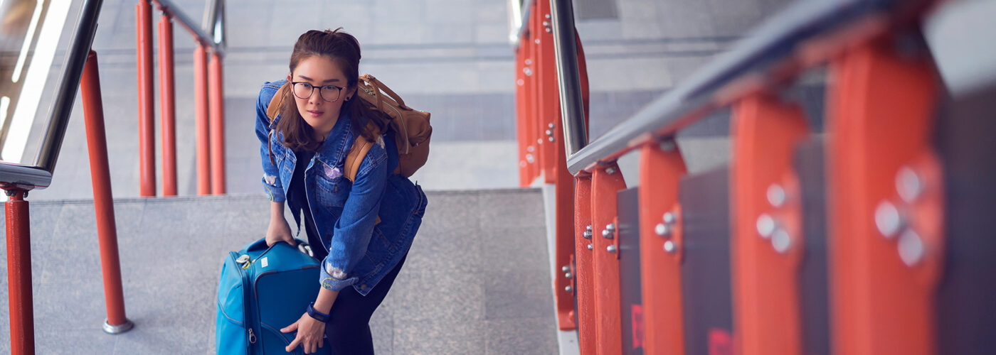 woman carrying luggage