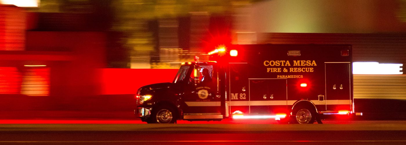 ambulance at night with lights flashing.