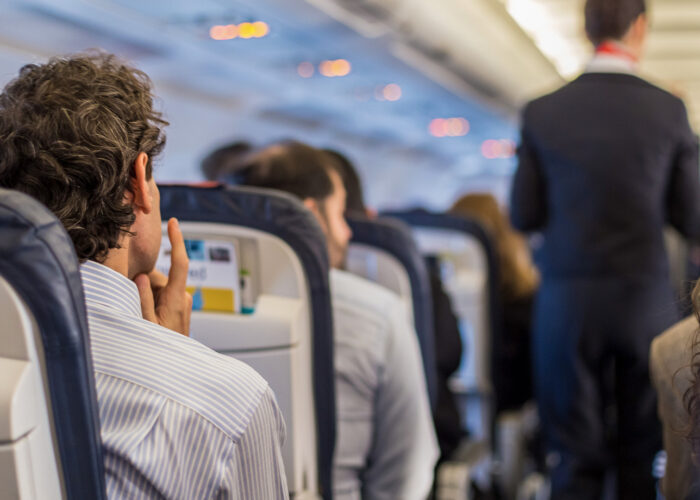 Passengers on the airplane.