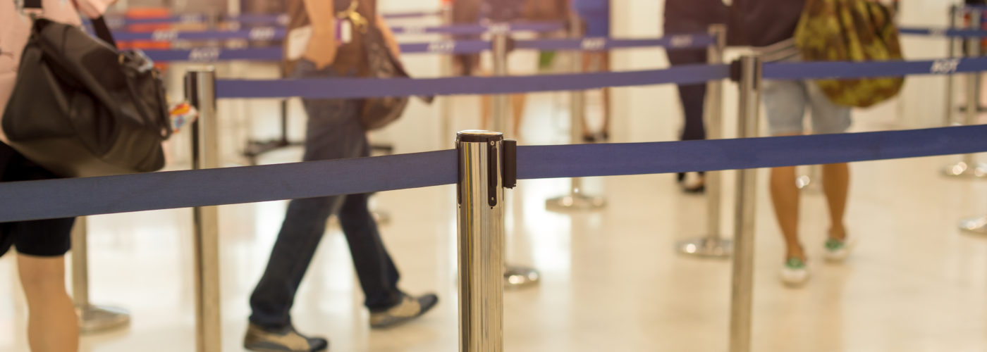 Passengers waiting in line at airport