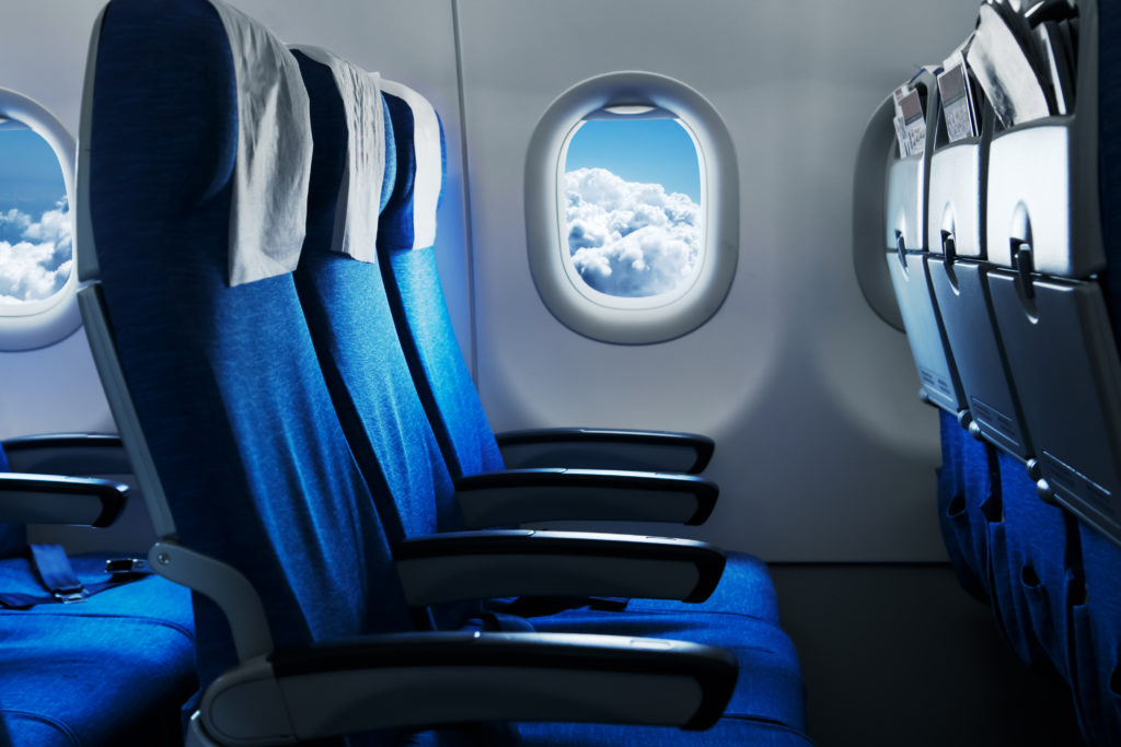 Empty row of plane seats on an airplane