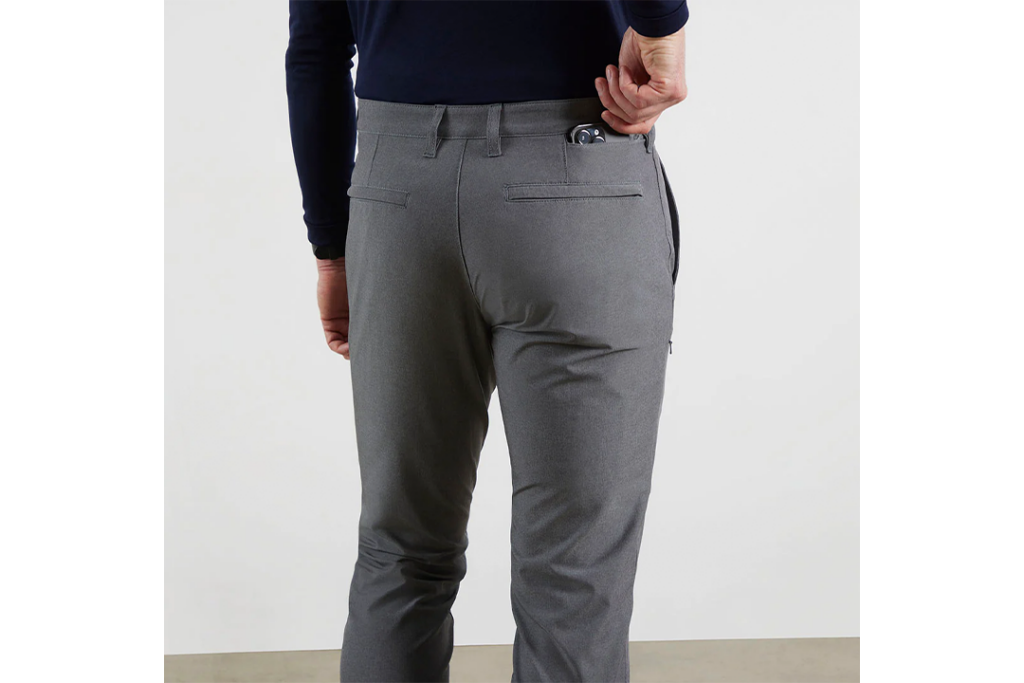 Man modeling Bluffworks Travel Pants secret pocket