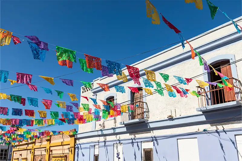 Colorful banners over a street in Todos Santos, Mexico