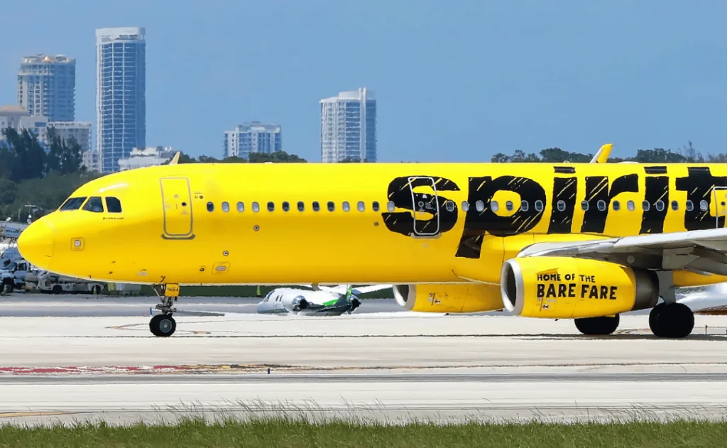 Spirit Airlines jet getting ready to take off from Fort Lauderdale Hollywood International Airport in Fort Lauderdale, Florida, USA.