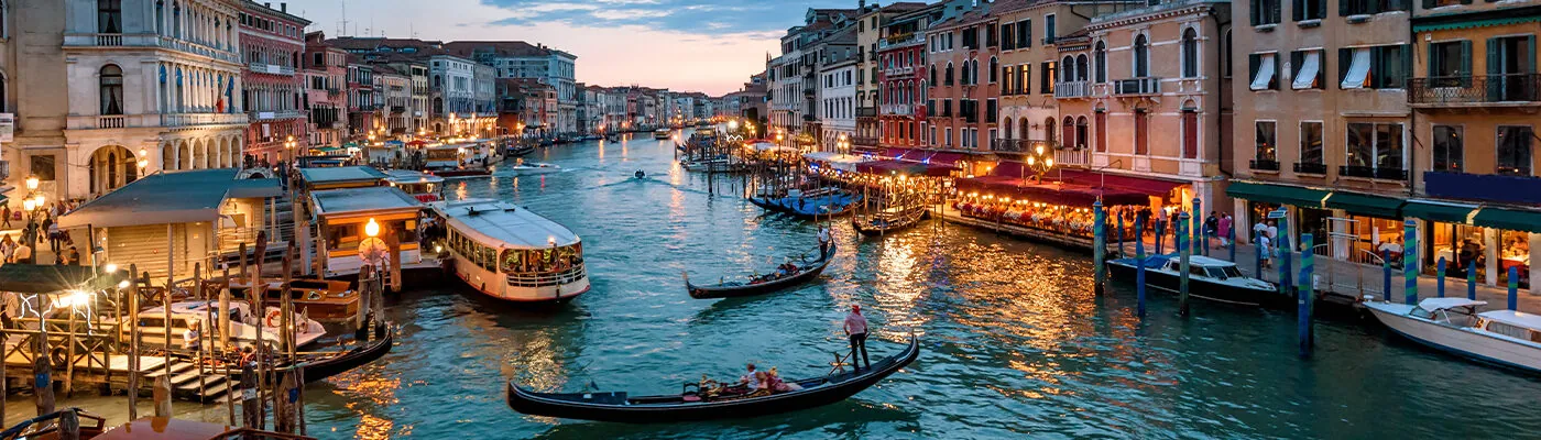 Panorama of Venice at night, Italy. Urban landscape with city lights.