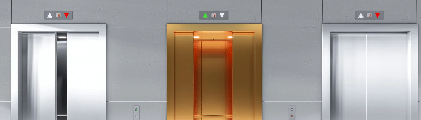 3 Elevator doors in a lobby