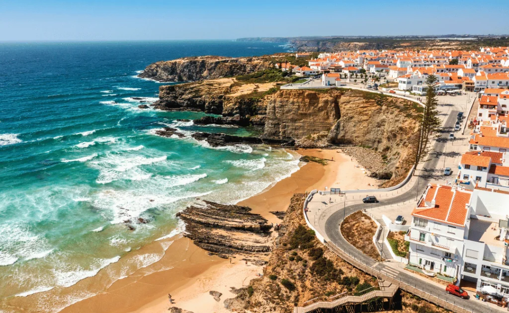 Aerial view of Zambujeira do Mar - charming town on cliffs by the Atlantic Ocean in Portugal